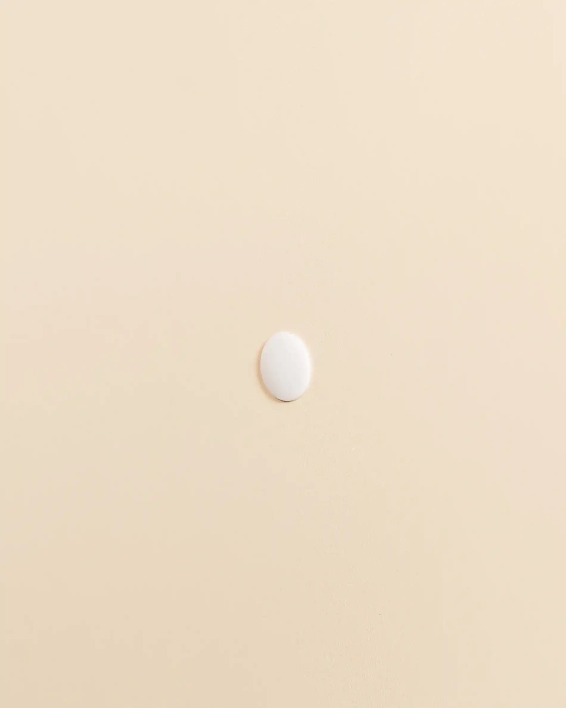 Tapa tornillos beige crema PILOTIS, vista de perfil