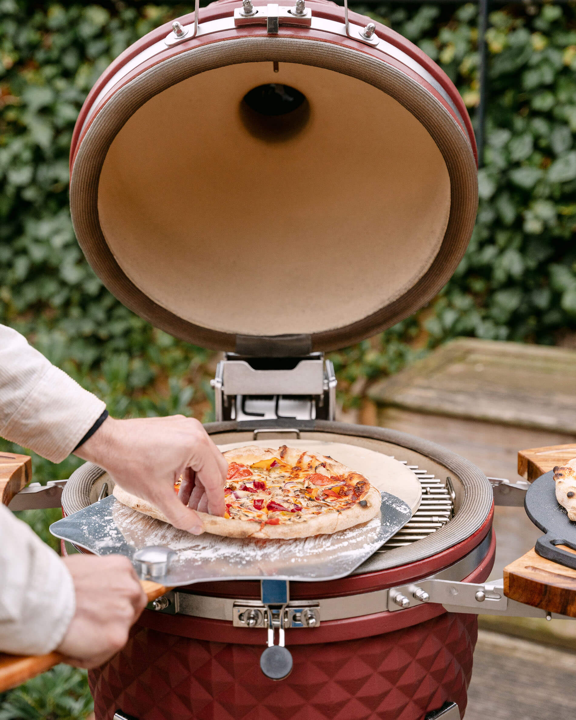 Pala para pizza de acero inoxidable y pizzas