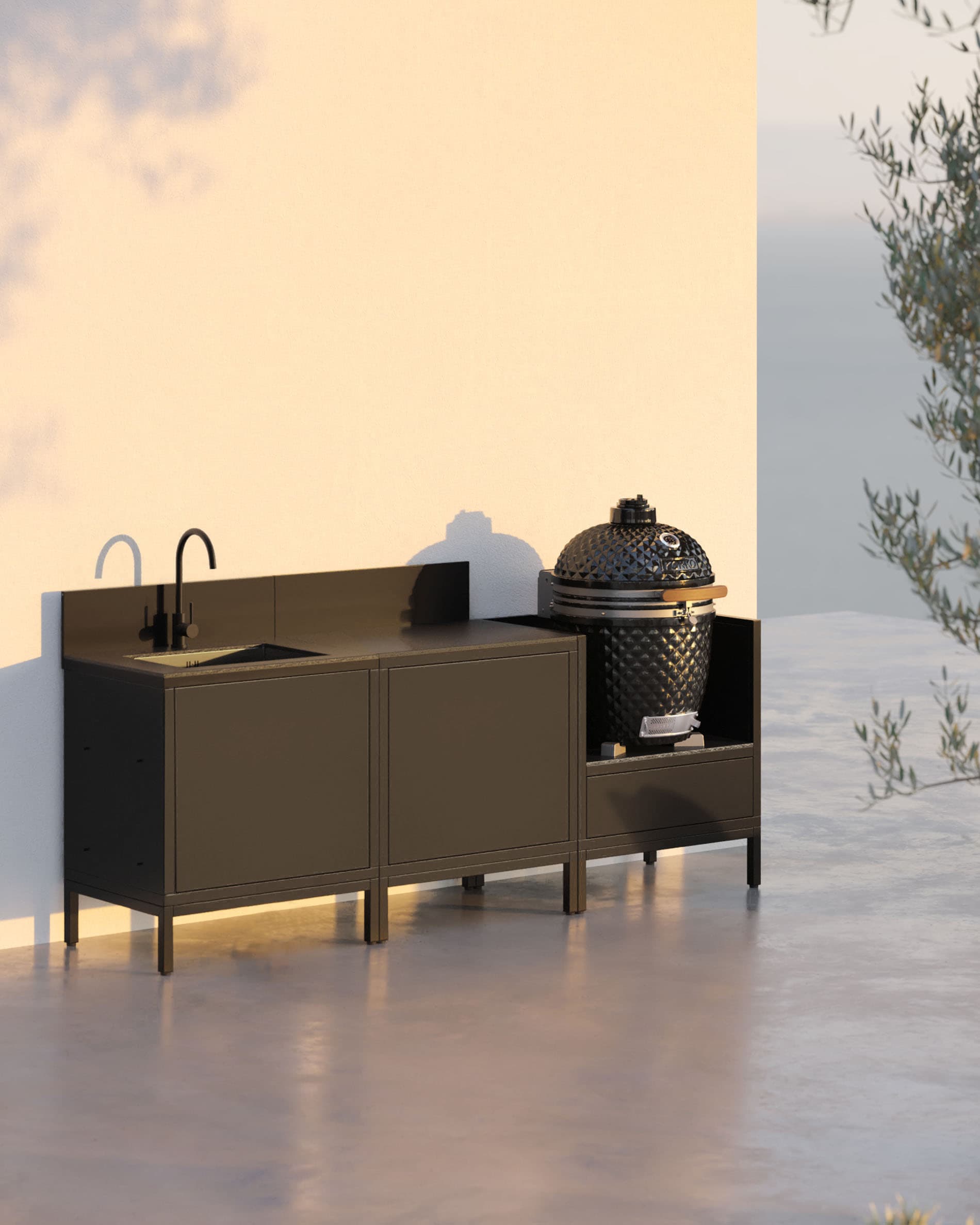 Cocina pilotis de 3 módulos con fregadero y kamado, mueble negro con una puerta de almacenamiento abierta y encimera oscura.