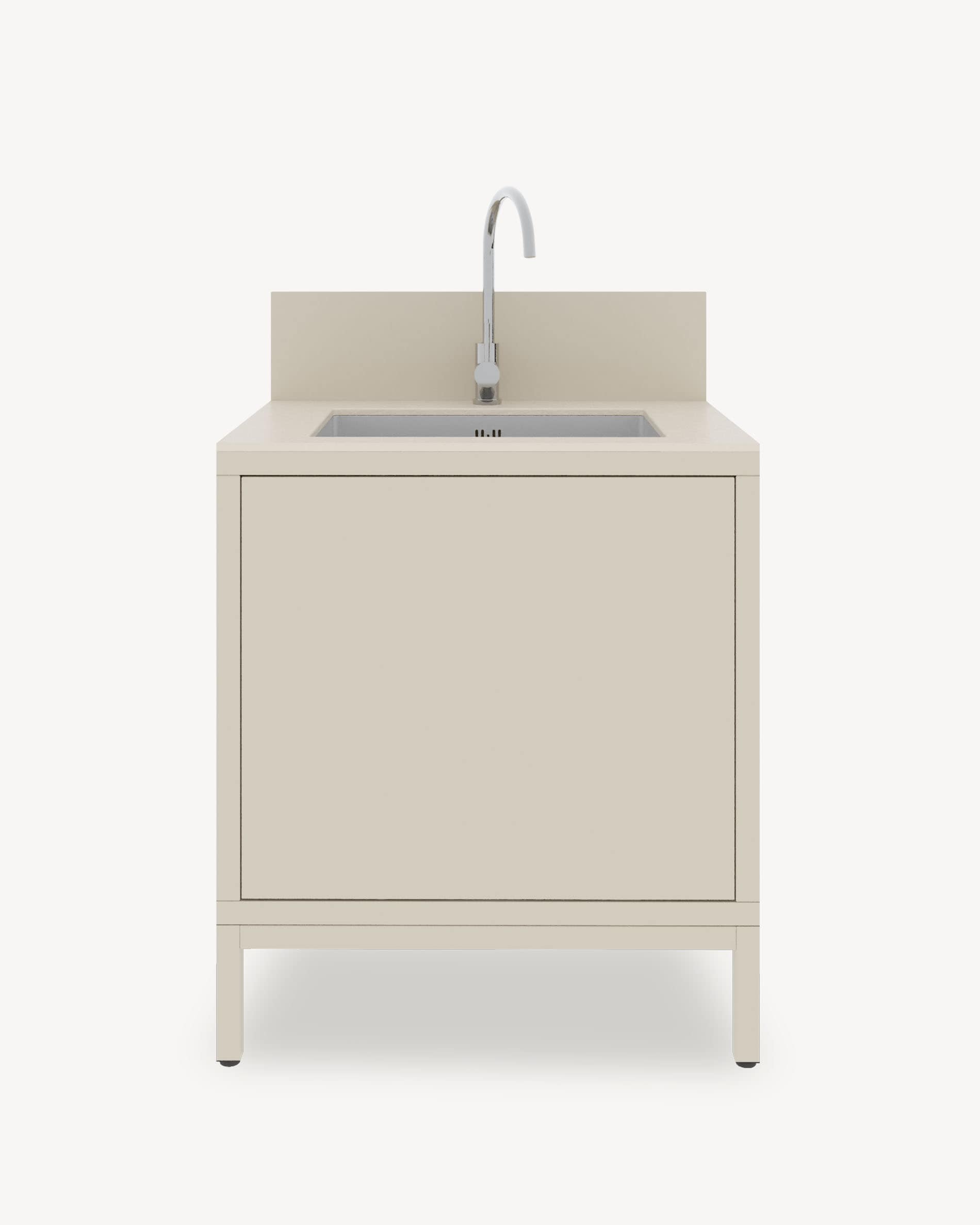 Módulo de cocina pilotis con fregadero integrado, mueble color crema con almacenamiento cerrado, encimera oscura y panel protector integrado.