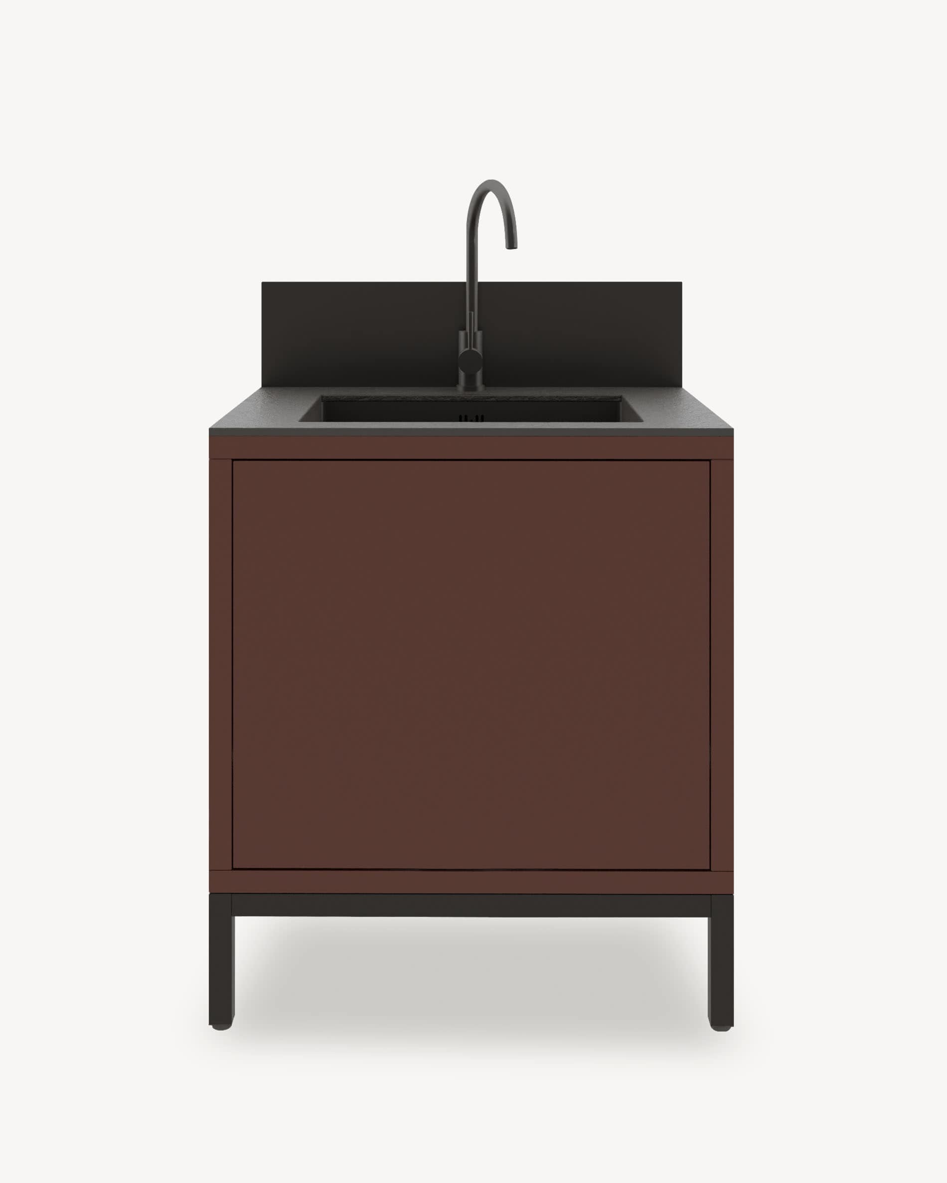 Módulo de cocina pilotis con fregadero integrado, mueble en color marrón óxido con almacenamiento cerrado, encimera oscura y panel protector integrado.